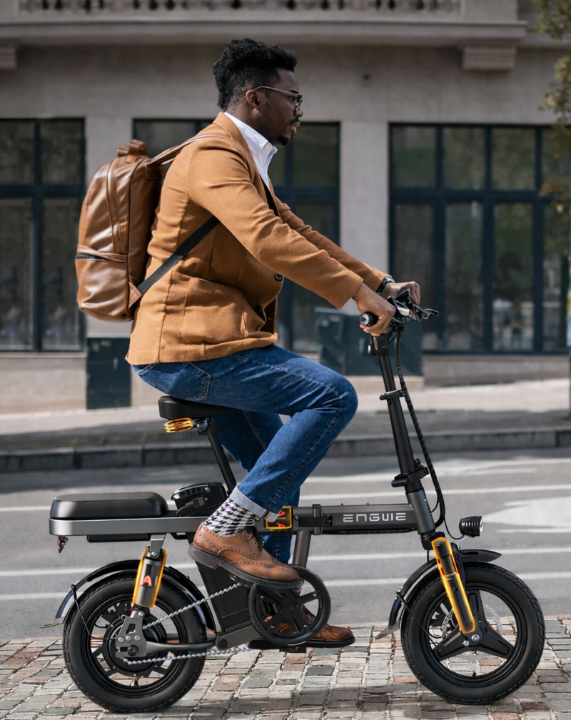 Man riding an electric bike on a city street